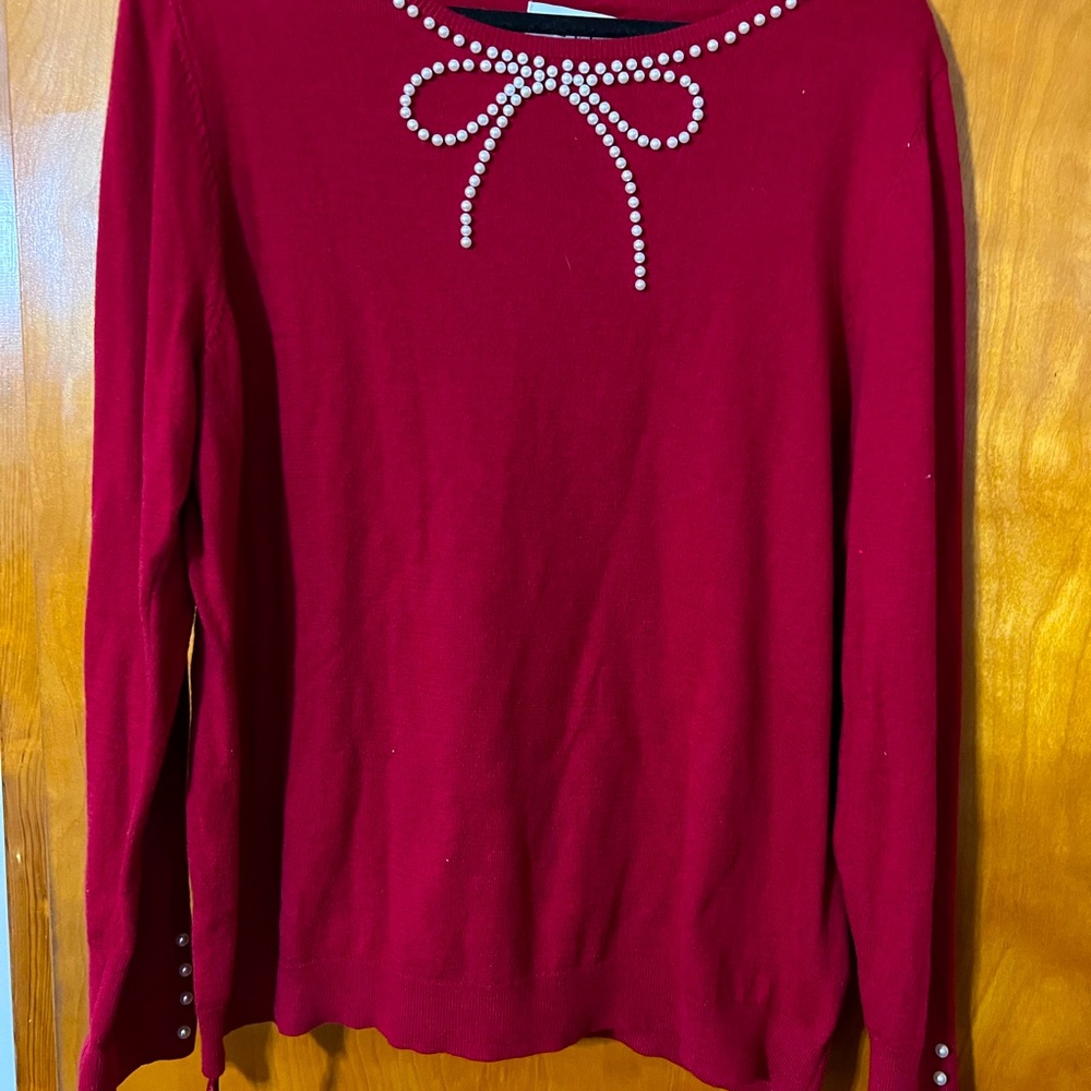 Pretty Red sweater with pearl accents.